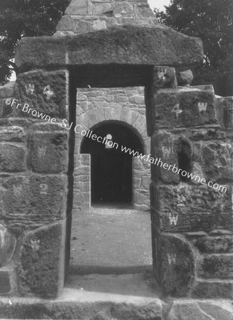 ST MOLUAS CELL TAKEN FROM FRIARS ISLAND & REECTED BESIDE PARISH CHURCH FROM WEST ENTRANCE